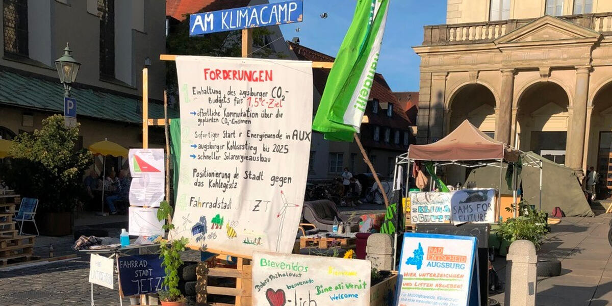 Klimacamp Augsburg agiert gegen kommerzielle Außenwerbung